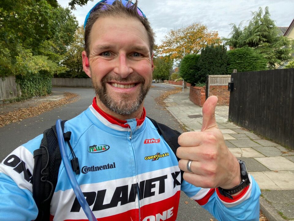 Paul stood taking a selfie in his running gear preparing for the Ironman