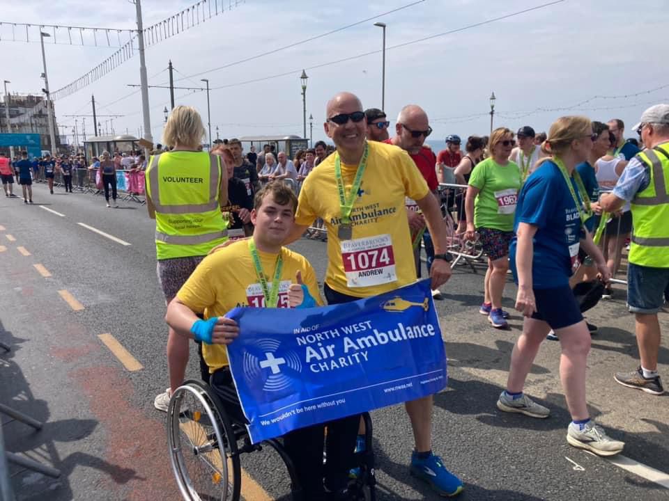 James and his dad after they'd crossed the finish line of the Blackpool 10k race