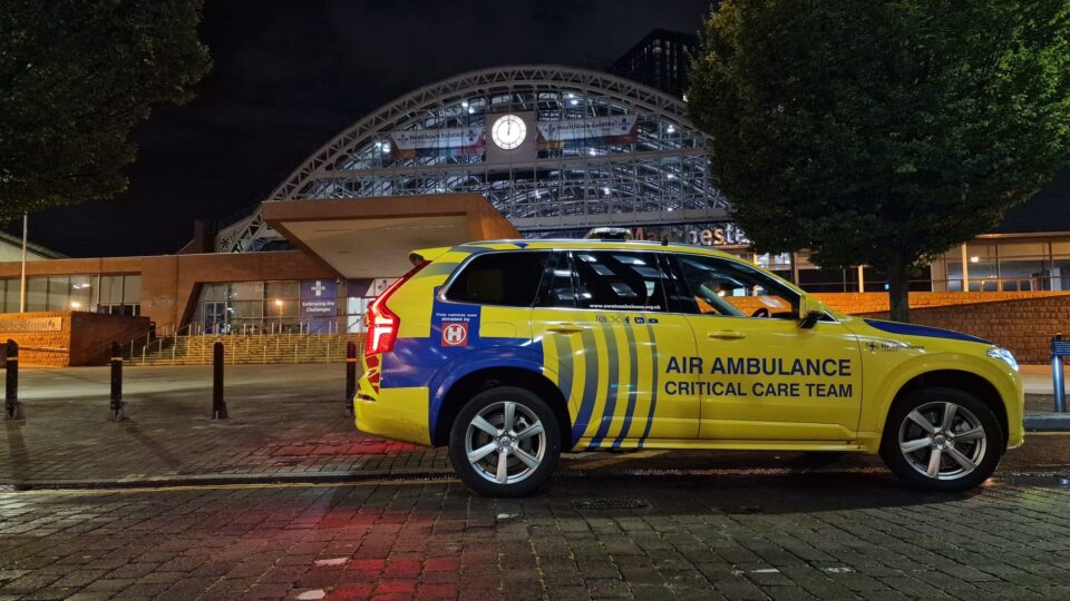 The charity's night car parked in front of Manchester Central event space at night