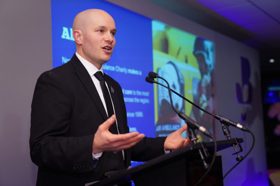 Chris, NWAA's Corporate and Partnerships Officer stood in front of a microphone talking about the charity at the chamber awards night