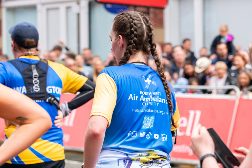 A runner dressed in an NWAA branded T shirt at one of the charity's running events 